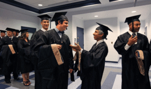 An accomplished surgeon, Arora said he learned from his fellow students in the MBA program. Near left, he and other degree candidates chat as they await the 2013 UMW commencement ceremony. Photo by Norm Shafer.