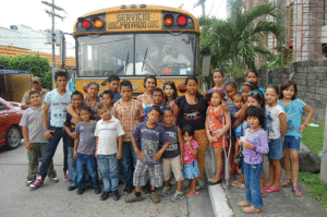 Children of Villa Soleada gather with some of their adult caregivers.