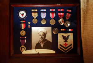 The Morrises display a collection of WWII medals earned in the Pacific by Juney, one of 27 male veterans on the GI Bill at Mary Washington in 1946.