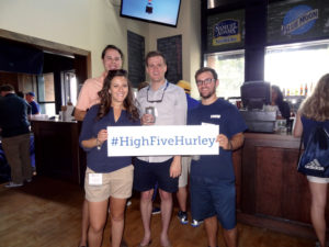 AlumniSeen1 -- New York Alumni Network members meet up – and think of President Hurley – during  a Mets game. 