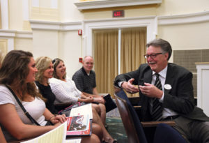 President Richard V. Hurley meets with students and parents during a recent freshman orientation. (Norm Shafer)