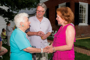 President and Mrs. Hurley share a moment on the Brompton lawn with Carol Bailey Miller ’50.