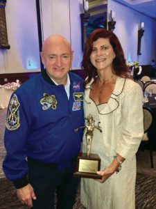 Nellie King was recognized for leadership at a Palm Beach reception. Here she is pictured with retired astronaut Mark Kelly, who spoke at the event.