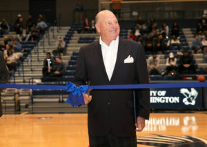 Ron Rosner cuts the ribbon at the dedication of the arena named in his honor.