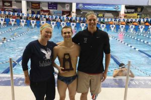 All-American Dallas Tarkenton at the 2016 NCAA Division III Swimming Championships is flanked by coaches Abby Brethauer and Dalton Herendeen.