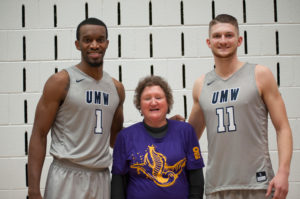 Eagles fan Grace Braxton poses between UMW basketball players Eric Shaw ’18, left, and Brent Mahoney ’17. (Photo by Alexander Sakes ’18)