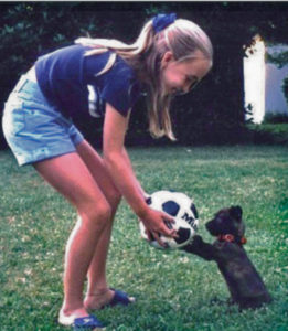 At 11, Exley played with Lucky, her family’s first rescued dog. Lucky lives with Exley’s parents today, 14 years later.
