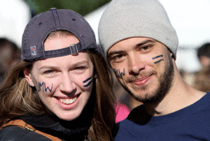 Celebrate your home away from home! Homecoming Weekend 2014, Oct. 24 & 25 Anne Marie Pipan '14 and Robert W. Sharp '14 wore UMW pride on their faces at last year's Homecoming Weekend. Photo by Karen Pearlman '00
